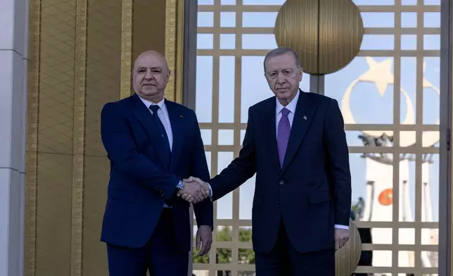 Turkish President Recep Tayyip Erdogan, right, shakes hands with his Lebanese counterpart Joseph Aoun before their meeting at the presidential palace in Ankara, Thursday, July 30, 2026. (Ugur Yildirim/DIA Photo via AP)