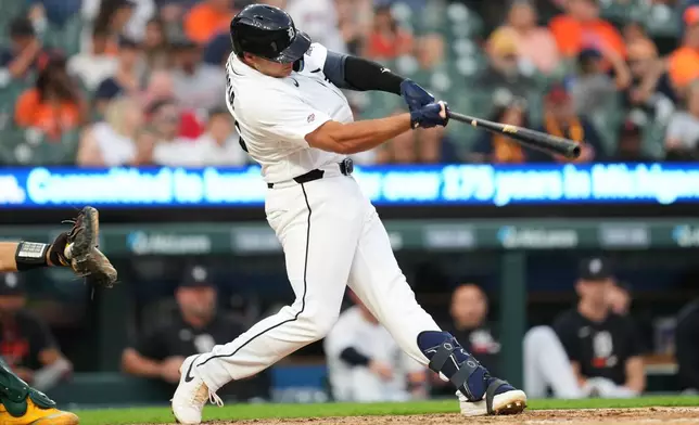 Detroit Tigers' Eduardo Valencia hits a home run against the Athletics during the seventh inning of a baseball game Thursday, July 9, 2026, in Detroit. (AP Photo/Paul Sancya)