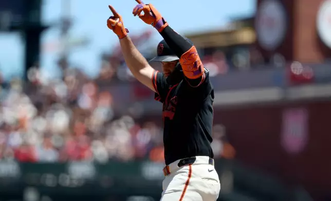 San Francisco Giants' Casey Schmitt celebrates after hitting an RBI single against the Los Angeles Angels during the third inning of a baseball game in San Francisco, Saturday, July 25, 2026. (AP Photo/Jed Jacobsohn)