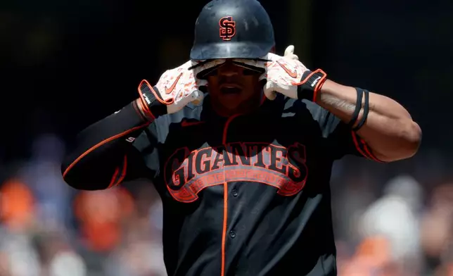 San Francisco Giants' Rafael Devers rounds the bases after hitting a three-run home run during the fourth inning of a baseball game against the Los Angeles Angels in San Francisco, Saturday, July 25, 2026. (AP Photo/Jed Jacobsohn)