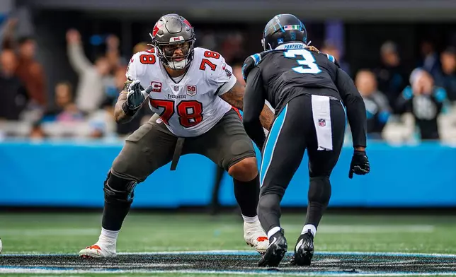 FILE - Tampa Bay Buccaneers offensive tackle Tristan Wirfs (78) looks to block Carolina Panthers linebacker Princely Umanmielen (3) during an NFL football game, Dec. 21, 2025, in Charlotte, N.C. (AP Photo/Rusty Jones, File)