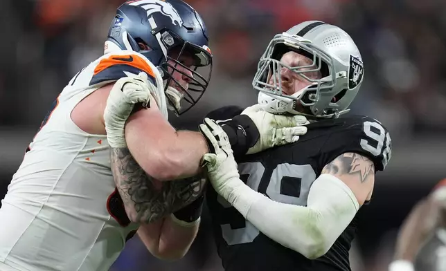 FILE - Denver Broncos offensive tackle Garett Bolles, left, blocks Las Vegas Raiders defensive end Maxx Crosby during the second half of an NFL football game in Las Vegas, Dec. 7, 2025. (AP Photo/Gregory Bull, File)