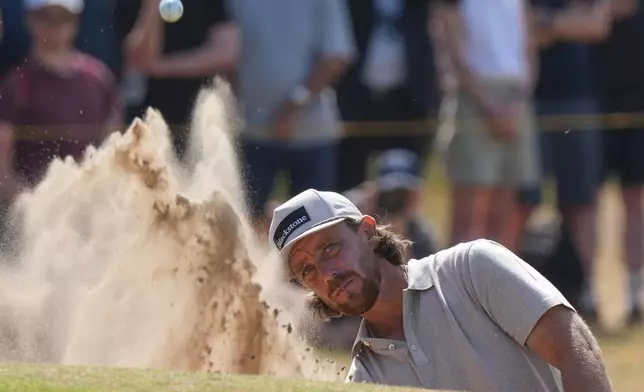 Tommy Fleetwood of England plays out of a bunker on the 4th green during the first day of the British Open Golf championships at Royal Birkdale golf club, in Southport, England, Thursday, July 16, 2026. (AP Photo/Jon Super)