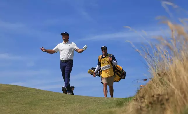 Bryson DeChambeau of the United States gestures as he walks the 7th hole during the first day of the British Open Golf championships at Royal Birkdale golf club, in Southport, England, Thursday, July 16, 2026. (AP Photo/Peter Morrison)