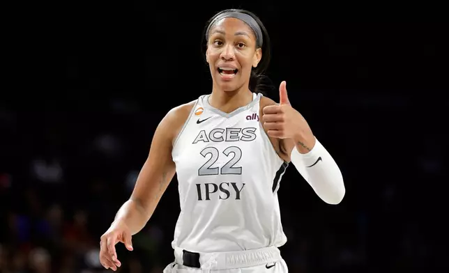 Las Vegas Aces center A'ja Wilson (22) gives a thumbs up during the first half of an WNBA basketball game against the Portland Fire Tuesday, July 28, 2026, in Las Vegas. (Steve Marcus/Las Vegas Sun via AP)