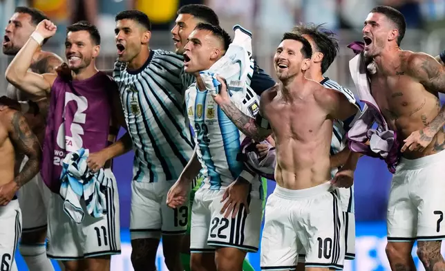 Argentina's Lionel Messi (10) and teammates celebrate their victory over Switzerland in the World Cup quarterfinal soccer match in Kansas City, Mo., Saturday, July 11, 2026. (AP Photo/Charlie Riedel)