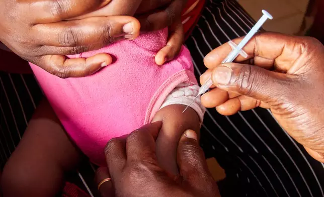 A baby receives a malaria vaccine at the Soa District Hospital in Yaounde, Cameroon, Wednesday, April 29, 2026. (AP Photo/Angel Ngwe)