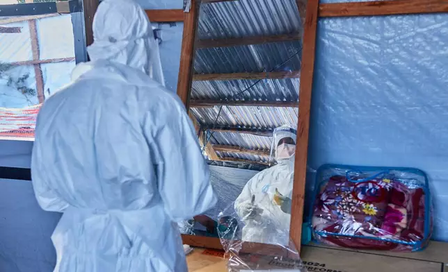 A view of a health worker at the Evangelical Medical Center, in Bunia, eastern Congo, Friday, July 3, 2026, where Ebola clinical trials are scheduled to take place. (AP Photo/Dirole Lotsima Dieudonne)