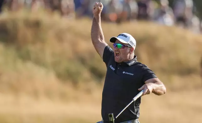 Ryan Fox of New Zealand celebrates on the 18th green after winning the British Open Golf championships at Royal Birkdale golf club, in Southport, England, Sunday, July 19, 2026. (AP Photo/Jon Super)