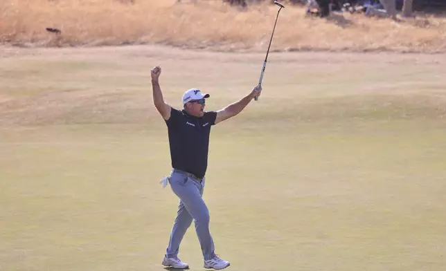 Ryan Fox of New Zealand celebrates on the 18th green after winning the British Open Golf championships at Royal Birkdale golf club, in Southport, England, Sunday, July 19, 2026. (AP Photo/Peter Morrison)