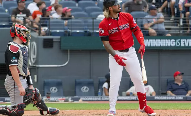 Cleveland Guardians' Gabriel Arias, right, watches his three-run home run off Chicago White Sox relief pitcher Erick Fedde as White Sox catcher Kyle Teel, left, looks on during the fifth inning of a baseball game, Sunday, July 5, 2026, in Cleveland. (AP Photo/Phil Long)