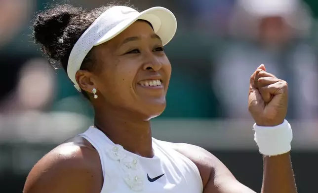 Naomi Osaka of Japan celebrates winning the third round women's singles match against Daria Kasatkina of Australia at the Wimbledon Tennis Championships in London, Friday, July 3, 2026.(AP Photo/Brian Inganga)