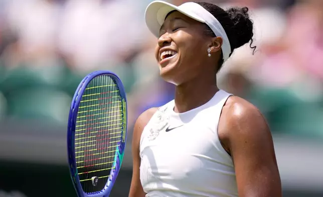 Naomi Osaka of Japan reacts during the third round women's singles match against Daria Kasatkina of Australia at the Wimbledon Tennis Championships in London, Friday, July 3, 2026.(AP Photo/Brian Inganga)