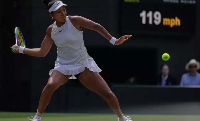 Naomi Osaka of Japan plays a return during the third round women's singles match against Daria Kasatkina of Australia at the Wimbledon Tennis Championships in London, Friday, July 3, 2026.(AP Photo/Brian Inganga)