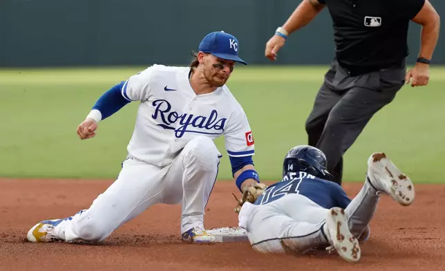 Kansas City Royals shortstop Bobby Witt Jr., left, tags out Tampa Bay Rays' Chandler Simpson, right, after attempting to steal second base during the fourth inning of a baseball game in Kansas City, Mo., Wednesday, July 1, 2026. (AP Photo/Colin E. Braley)
