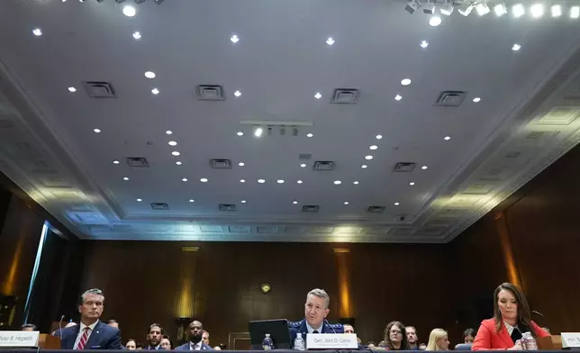 Defense Secretary Pete Hegseth, Chairman of the Joint Chiefs of Staff Gen. Dan Caine and Agriculture Secretary Brooke Rollins testify at a Senate Appropriations Committee hearing, Tuesday, July 21, 2026, on Capitol Hill in Washington. (AP Photo/Jacquelyn Martin)