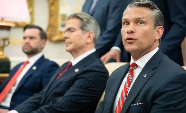 Defense Secretary Pete Hegseth speaks as President Donald Trump meets with Lebanese President Joseph Aoun in the Oval Office at the White House, Tuesday, July 21, 2026, in Washington. (AP Photo/Mark Schiefelbein)