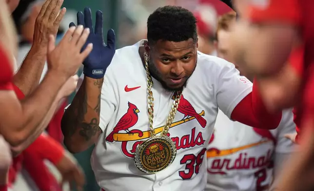 St. Louis Cardinals' Nelson Velázquez is congratulated by teammates after hitting a two-run home run during the sixth inning in the second game of a baseball doubleheader against the Milwaukee Brewers Tuesday, July 7, 2026, in St. Louis. (AP Photo/Jeff Roberson)