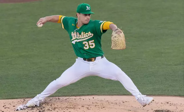 Athletics pitcher J.T. Ginn throws to the Los Angeles Dodgers during the first inning of a baseball game Wednesday, July 1, 2026, in West Sacramento, Calif. (AP Photo/Sara Nevis)