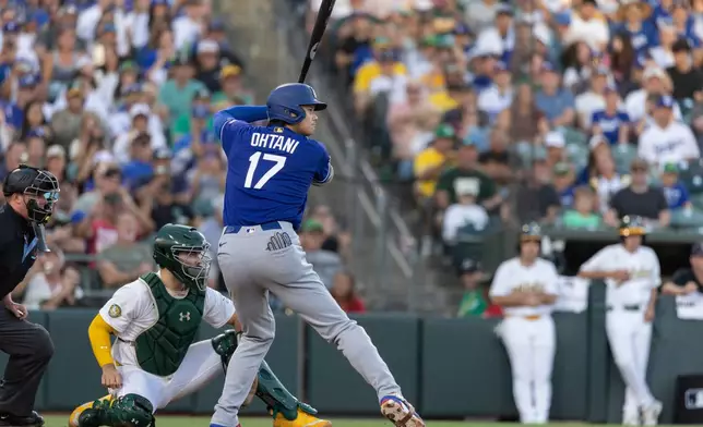 Los Angeles Dodgers' Shohei Ohtani at-bat during the sixth inning of a baseball game against the Athletics Tuesday, June 30, 2026, in West Sacramento, Calif. (AP Photo/Sara Nevis)