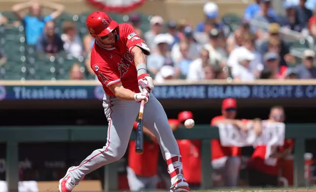 Los Angeles Angels' Mike Trout hits a double during the third inning of a baseball game against the Minnesota Twins, Saturday, July 11, 2026, in Minneapolis. (AP Photo/Bailey Hillesheim)