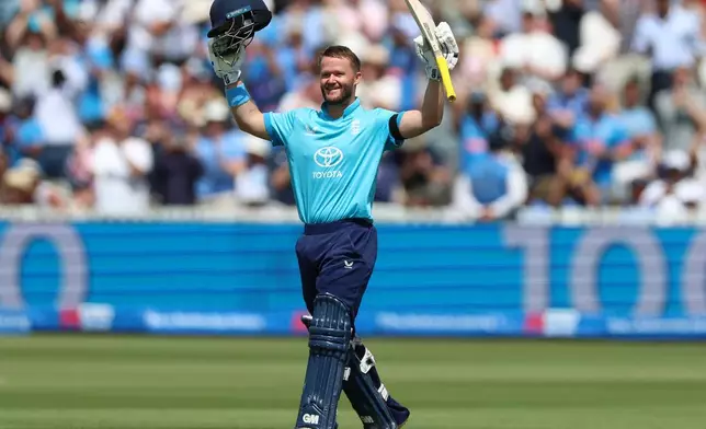England's Ben Duckett celebrates reaching his century during the third ODI between England and India, at Lord's cricket ground, London, Sunday, July 19, 2026. (Steven Paston/PA via AP)