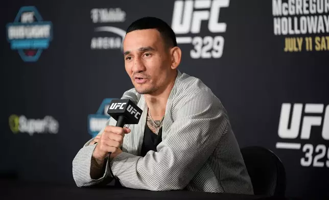 Max Holloway speaks during a news conference for the UFC 329 mixed martial arts event Wednesday, July 8, 2026, in Las Vegas. (AP Photo/John Locher)