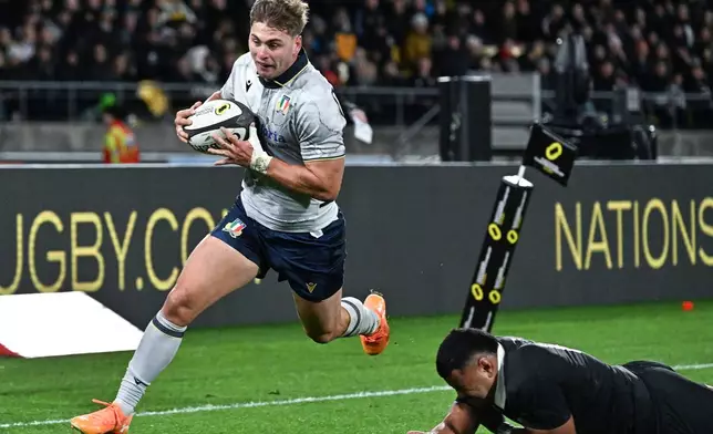 Leonardo Marin of Italy runs in to score a try during the Nations Championship rugby international between the All Blacks and Italy in Wellington, New Zealand, Saturday, July 11, 2026. (Masanori Udagawa/Photosport via AP)
