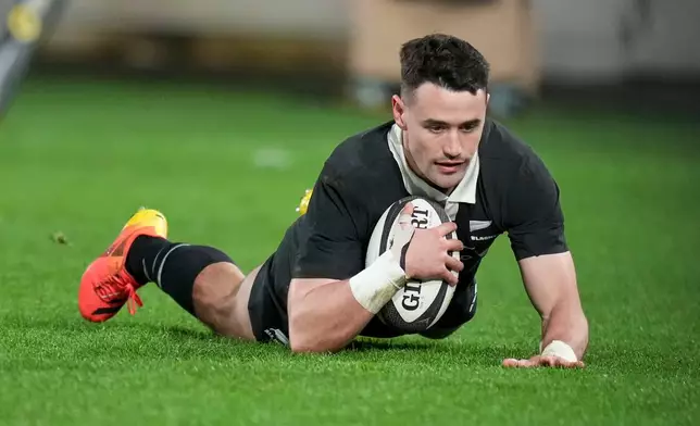 New Zealand's Will Jordan scores a try during the Nations Championship rugby international between the All Blacks and Italy in Wellington, New Zealand, Saturday, July 11, 2026. (Marty Melville/Photosport via AP)