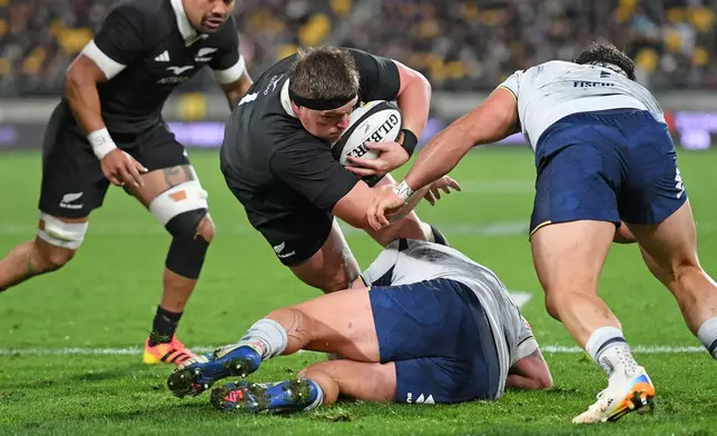 New Zealand's Ethan de Groot is tackled short of the try line during the Nations Championship rugby international between the All Blacks and Italy in Wellington, New Zealand, Saturday, July 11, 2026. (Kerry Marshall/Photosport via AP)