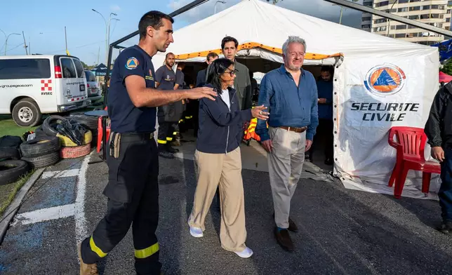 Lieutenant-Colonel Vianney Labbe, left, head of the detachment of the French 7th Civil Security Training and Intervention Regiment (RIISC 7), Venezuela's interim President Delcy Rodriguez, center, Oliver Blanco, Venezuela's Vice Minister for Europe and North America, and French ambassador to Venezuela Emmanuel Pineda, right, visit a temporary camp of the French Civil Security in La Guaira, Wednesday, July 1, 2026, following the June 24 earthquakes. (Miguel Medina/Pool Photo via AP)