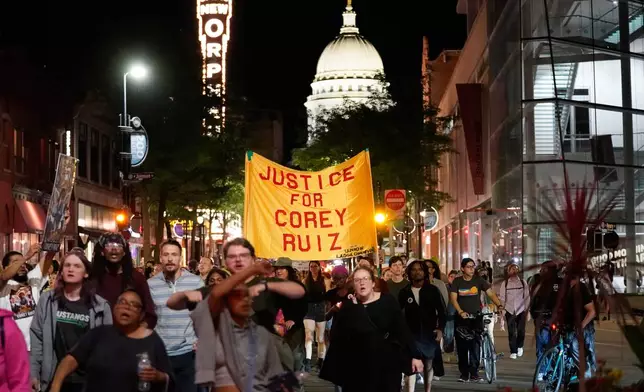 Protesters march past the Capitol, Thursday, July 23, 2026, in Madison, Wis., after a Madison police officer shot and killed Corey Durell Ruiz on Wednesday. (AP Photo/Kayla Wolf)