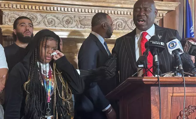 Kah'liyah Aliomar, the daughter of Corey Ruiz, who was shot and killed by a Madison police officer, wipes away tears as attorney Ben Crump speaks at a news conference on Friday, July 24, 2026, in Madison, Wis. (AP Photo/Scott Bauer)