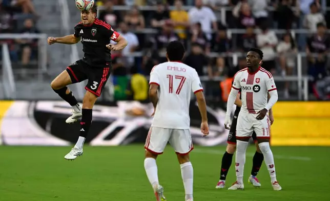 D.C. United defense Lucas Bartlett (3) heads the ball during the first half of an MLS soccer match against Toronto FC, Saturday, July 25, 2026, in Washington. (AP Photo/John McDonnell)
