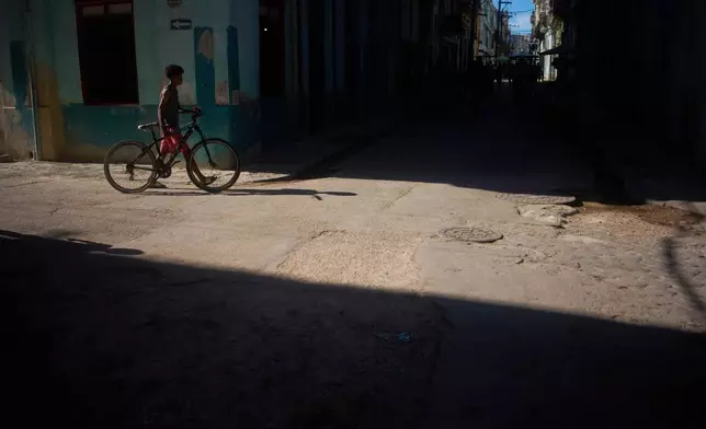 A man with his bicycle in Havana, Cuba, Tuesday, June 30, 2026. (AP Photo/Ramon Espinosa)