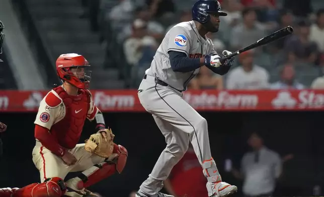 Houston Astros' Yordan Alvarez (44) watches his go-ahead RBI single against the Los Angeles Angels during the ninth inning of a baseball game Tuesday, July 28, 2026, in Anaheim, Calif. (AP Photo/Scott Strazzante)