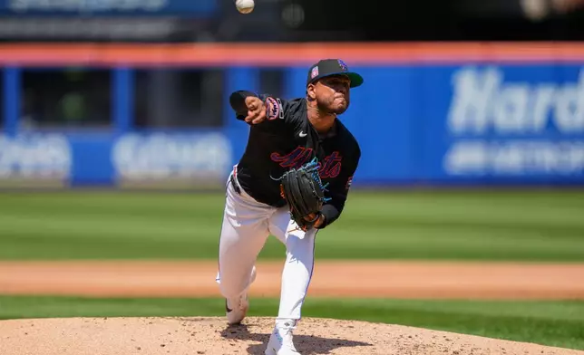 New York Mets pitcher Freddy Peralta throws during the second inning of a baseball game against the Los Angeles Dodgers, Sunday, July 26, 2026, in New York. (AP Photo/Yuki Iwamura)
