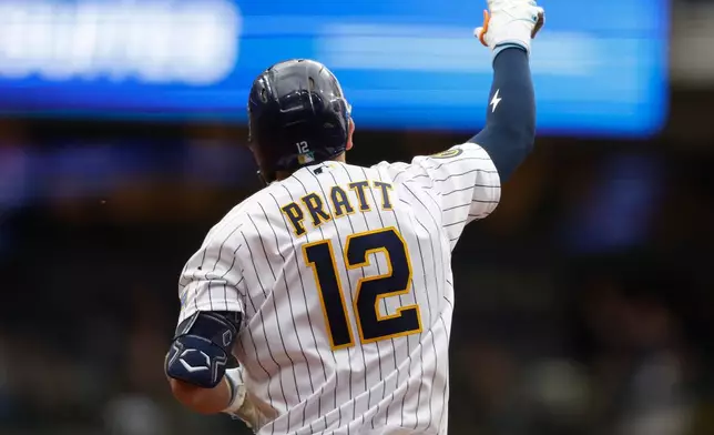Milwaukee Brewers' Cooper Pratt (12) reacts after his home run during the second inning of a baseball game against the Colorado Rockies, Saturday, July 25, 2026, in Milwaukee. (AP Photo/Jeffrey Phelps)