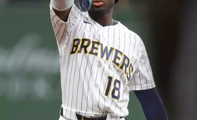 Milwaukee Brewers' Luis Lara reacts after his two-RBI double during the sixth inning of a baseball game against the Colorado Rockies, Saturday, July 25, 2026, in Milwaukee. (AP Photo/Jeffrey Phelps)