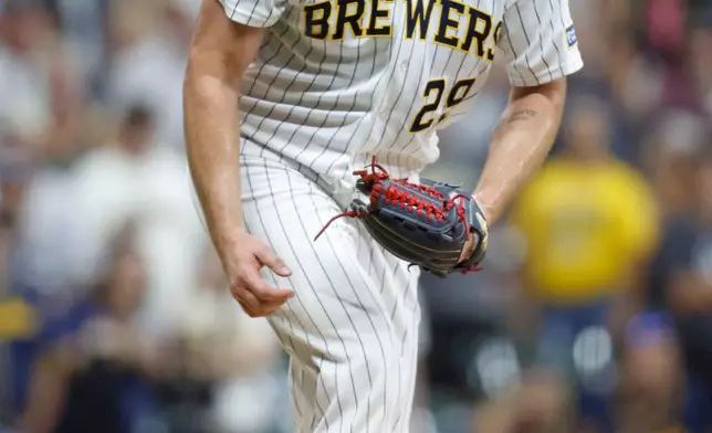 Milwaukee Brewers pitcher Trevor Megill (29) reacts after the last out during the ninth inning of a baseball game against the Colorado Rockies, Saturday, July 25, 2026, in Milwaukee. (AP Photo/Jeffrey Phelps)
