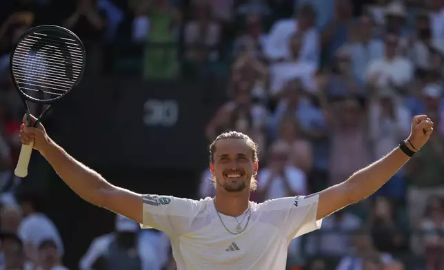 Alexander Zverev of Germany celebrates winning against Taylor Fritz of the United States in their quarter-final men's singles match at the Wimbledon Tennis Championships in London, Wednesday, July 8, 2026. (AP Photo/Kin Cheung)