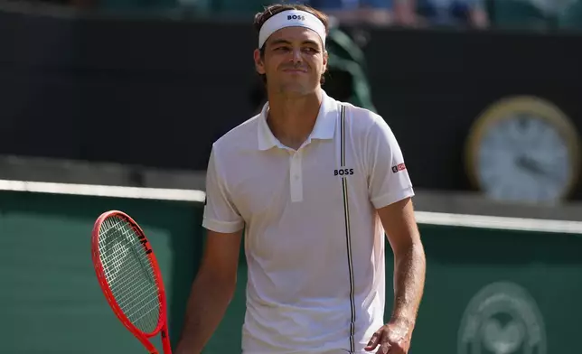Taylor Fritz of the United States reacts to losing a point against Alexander Zverev of Germany in their quarter-final men's singles match at the Wimbledon Tennis Championships in London, Wednesday, July 8, 2026. (AP Photo/Kin Cheung)