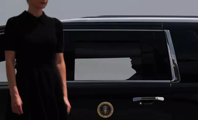 President Donald Trump departs a dignified transfer while Natalie Harp stands outside the vehicle, Wednesday, July 22, 2026, at Dover Air Force Base, Del. (AP Photo/Julia Demaree Nikhinson)