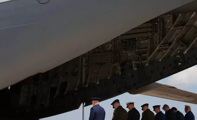 President Donald Trump, far right, and Defense Secretary Pete Hegseth, second from right, attend the dignified transfer of four U.S. service members recently killed in the Middle East, Wednesday, July 22, 2026, at Dover Air Force Base, Del. (AP Photo/Julia Demaree Nikhinson)