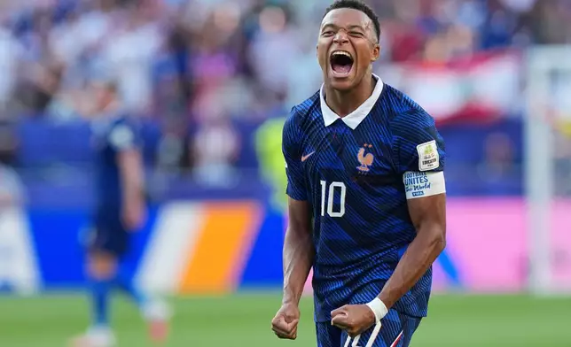 France's Kylian Mbappe (10) celebrates his team victory at the end of the World Cup round of 16 soccer match between Paraguay and France in Philadelphia, Saturday, July 4, 2026. (AP Photo/Martin Meissner)