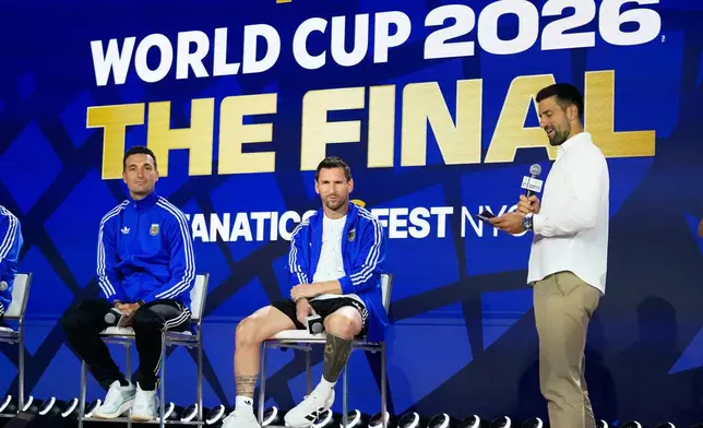 Argentina's Lionel Messi, head coach Lionel Scaloni listens to tennis player Novak Djokovic during a news conference ahead of the World Cup final soccer match between Spain and Argentina in New York, Friday, July 17, 2026. (AP Photo/Frank Franklin II)
