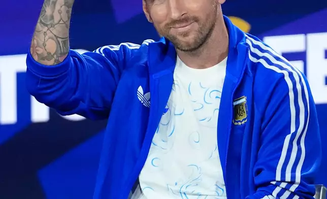 Argentina's Lionel Messi waves during a news conference ahead of the World Cup final soccer match between Spain and Argentina in New York, Friday, July 17, 2026. (AP Photo/Frank Franklin II)