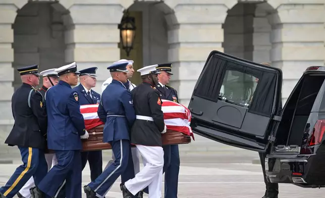 An Armed Forces Body Bearer Team moves the casket of Sen. Lindsey Graham, R-S.C., from the U.S. Capitol, Tuesday, July 28, 2026, in Washington. (AP Photo/Rod Lamkey, Jr.)