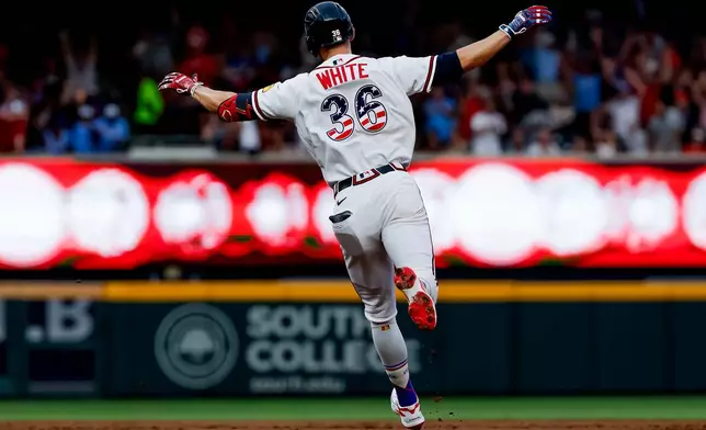Atlanta Braves' Eli White reacts while rounding the bases after hitting solo home run against the New York Mets during the second inning of a baseball game, Saturday, July 4, 2026, in Atlanta. (AP Photo/Erik S. Lesser)