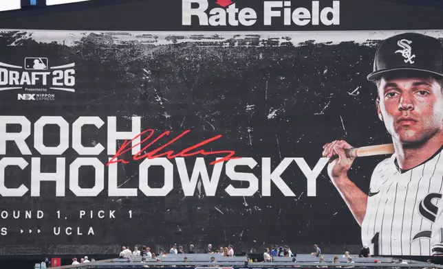UCLA shortstop Roch Cholowsky goes No. 1 overall to the Chicago White Sox during the 2026 MLB Draft shown on the scoreboard before a baseball game between the Chicago White Sox and the Athletics Saturday, July 11, 2026, in Chicago. (AP Photo/David Banks)